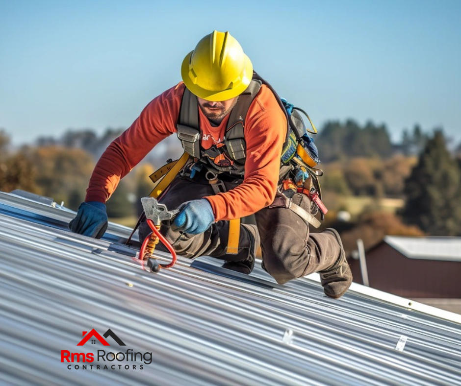 Roofing crew performing a post-installation cleanup, removing debris and inspecting for nails with a magnetic tool.